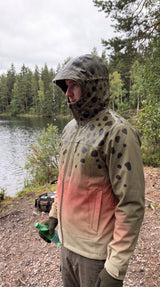 Troutwear fisherman wearing jacket in the rain